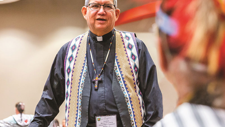 Father Maurice Henry Sands, director of the Black and Indian Mission Office and a longtime member of the Knights of Columbus, speaks to a participant at the 80th annual Tekakwitha Conference, which was hosted in Sharonville, Ohio, July 9. Photo by Matthew Allen