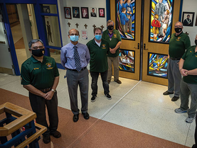 Members of St. Patrick’s Council 7689 and brother Knights who teach at Father Michael McGivney Catholic Academy in Ontario stand outside the school’s chapel