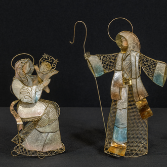 Metal and Capiz shell figurines of St. Joseph and Mary holding the Christ Child.