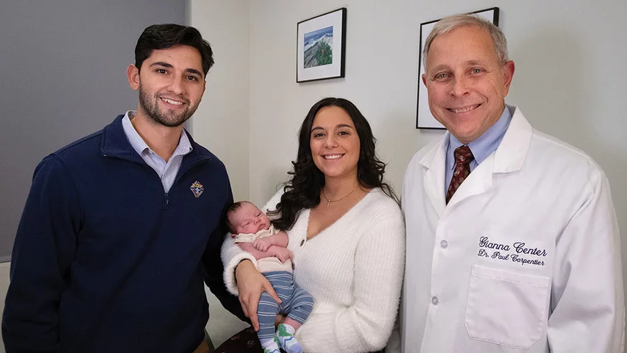 Franco and Katelyn Pellicciotta and their new baby visit with Dr. Paul Carpentier, director of the Gianna Center in Babylon, N.Y. (Photo by Jeffrey Bruno)