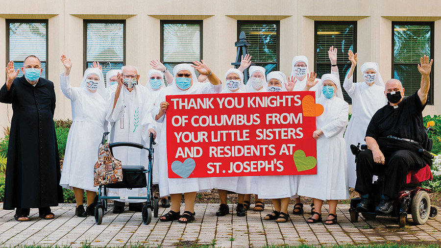 Sisters and several priest residents at the St. Joseph’s Home in Palatine, Ill., express their thanks to the Knights of Holy Ghost Council 4977.