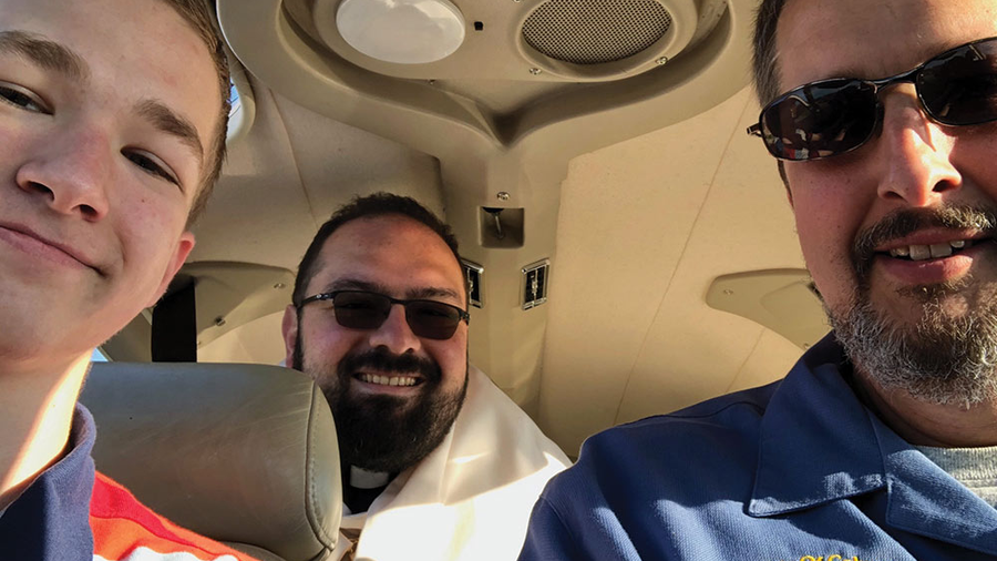 Father Gervan Menezes, chaplain of Blessed Pier Giorgio Frassati Council 15020 in Nashville, Tenn., carries the Blessed Sacrament in the backseat of Daniel Schachle’s Piper Archer plane