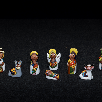 Crèche from Bolivia by an Aymara artist. Painted clay Nativity with Holy Family, an Angel, 3 Magi, a donkey, a llama, an ox, and a lamb.