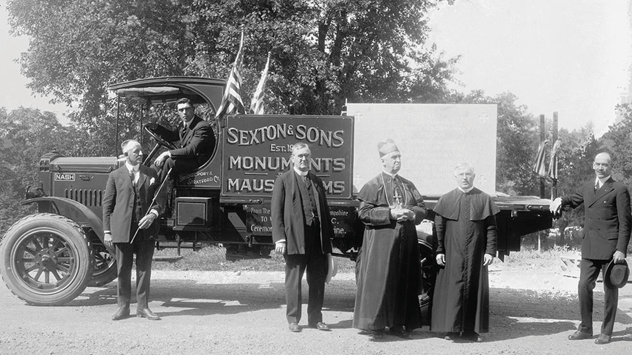 James J. Sexton (far left) delivers the foundation stone for the new national shrine to Bishop Thomas J. Shahan (second from right) and other dignitaries Sept. 19, 1920.