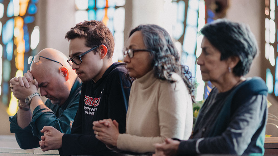 Matthew prays with his parents