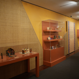 Photo of a museum gallery with Nativity scenes from Africa on exhibit.