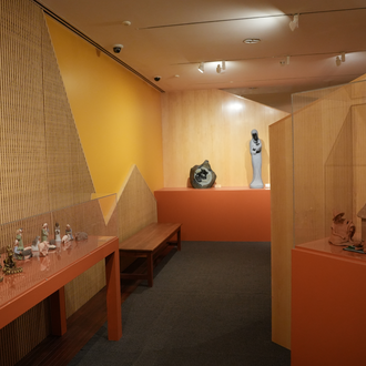 Photo of a museum gallery with Nativity scenes from Africa on exhibit.