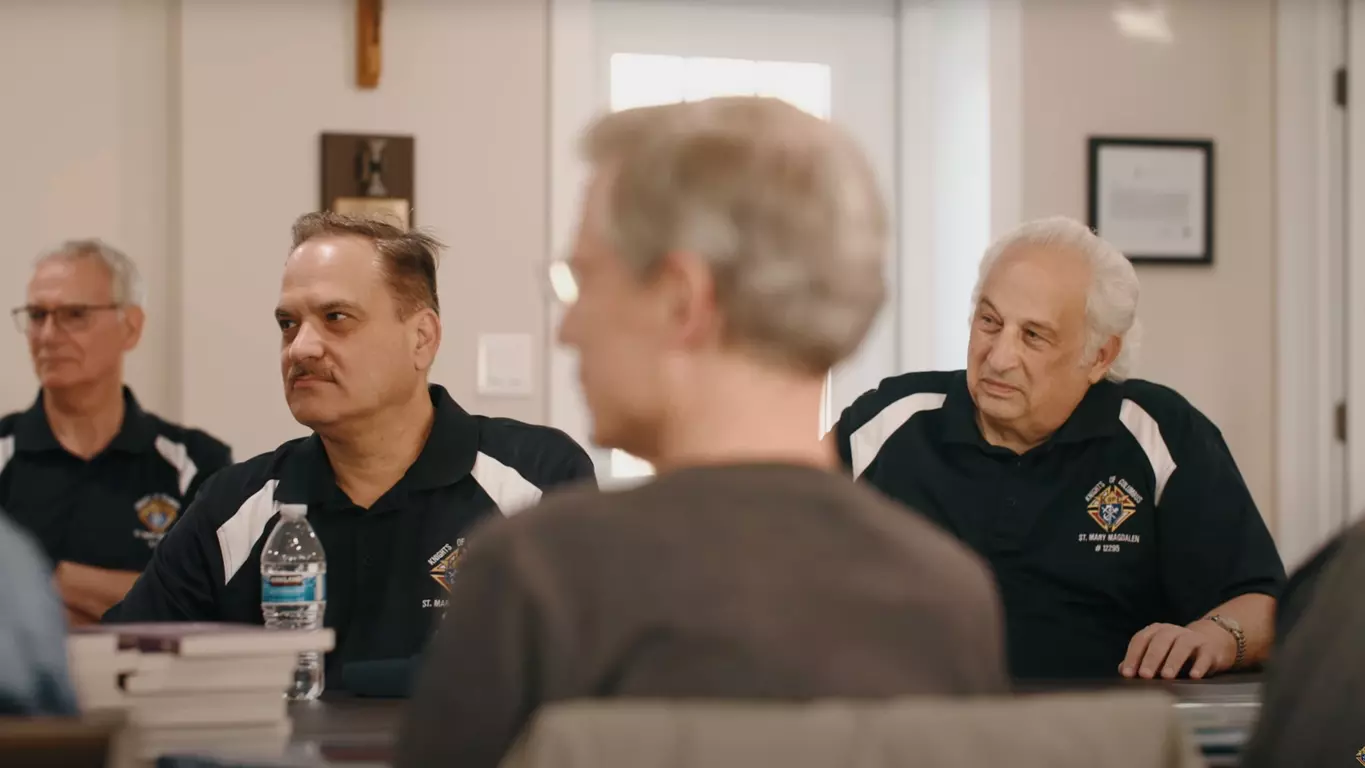 Knights gathered during a meeting for Cor.