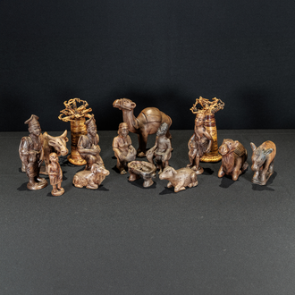 Photo of a clay Nativity scene featuring the Holy Family, Magi, shepherds, and animals. 