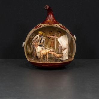 Photo of a banana leaf Nativity scene contained within a hollowed-out gourd.