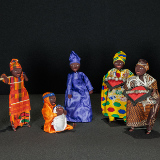 Photo of a batik fabric Nativity scene featuring the Holy Family, Magi, and shepherds.