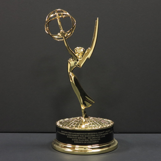 Emmy Award for Everyday Heroes episode "No Greater Love." Statuette of a winged woman holding an atom on a circular platform.