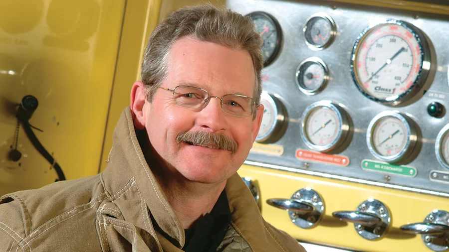Tom Bagley stands beside a fire truck at Halifax International Airport in this 2003 photo.