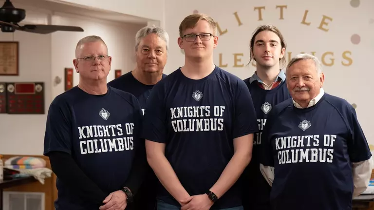 Knights take a photo while volunteering at Little  Blessings Baby Pantry.