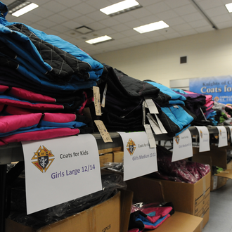 The Knights of Columbus Coats for Kids program launched in 2009, providing warmth to kids needing winter coats.
