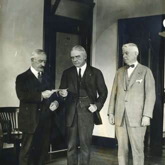 Supreme Knight Flaherty presents American Red Cross chairman Judge John Barton Payne with a check for $25k after the Great Kanto Earthquake in 1923.