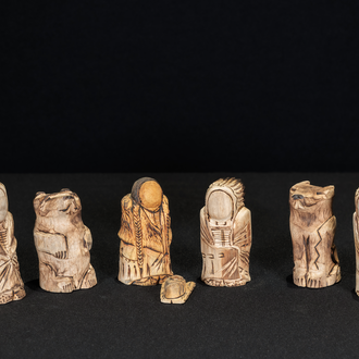 Wood carved Lakota Nativity scene with the Holy Family and three Magi in indigenous clothing. Also included is figures of an eagle, wolf, and bear.