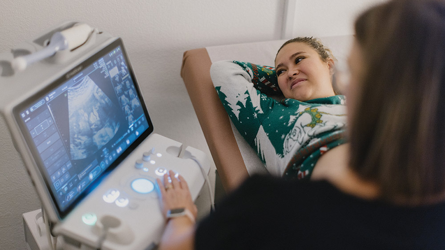 An expectant mother sees images of her unborn baby on a K of C-funded ultrasound machine at Guiding Star Las Cruces.