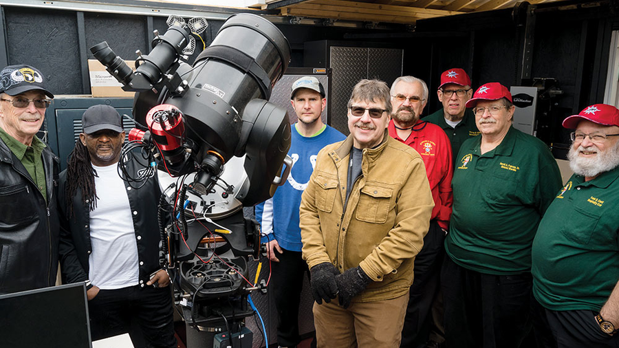Jim Surman (in red) and other Knights from Assembly 940 gather with astronomy volunteer Rich Dollish (center) and several veterans in the new Sky Shed Observatory.