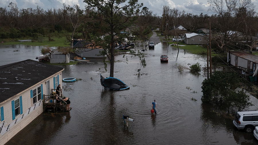 A man walks to his home in Cut Off, a small town in southeastern Louisiana