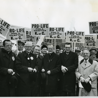 Supreme Knight Dechant stands with Washington-area bishops at the 1980 March for Life. The signs were printed by the K of C.