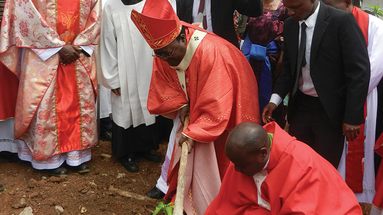  Archbishop Cyprian Kizito Lwanga of Kampala plants a tree