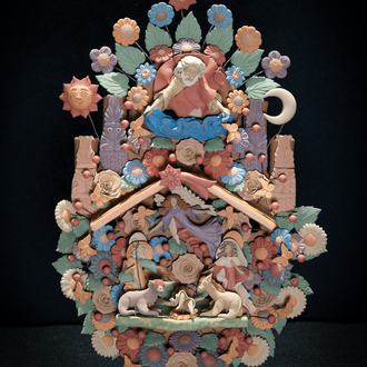 A Nativity Tree of Life that has God at the top with the sun & moon. A star is above the stable which holds the Holy Family, an angel, ox & donkey.