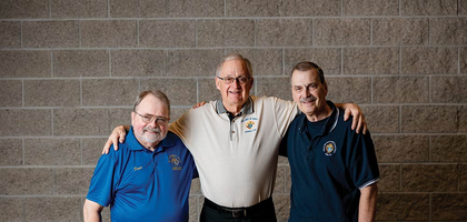 From left, Dave Spacht, Phil Legler and Greg Penco stand with just a few of the thousands of baby bottles that Knights in the area used to collect $109,000 for a mobile ultrasound unit.