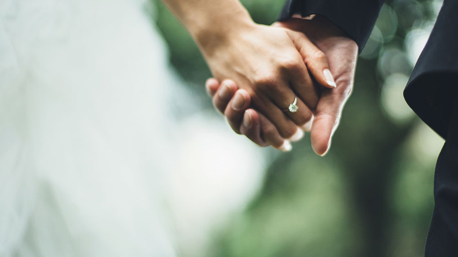 Man women holding hands