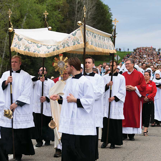 MARIAN ROUTE | Bishop Andrew Cozzens of Crookston, Minn., processes with the Eucharist to the headwaters of the Mississippi River in Itasca State Park for the launch of the Marian Route of the National Eucharistic Pilgrimage on May 19. (OSV News photo/Courtney Meyer).