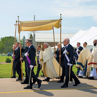 MARIAN ROUTE | Bishop David Ricken of Green Bay, Wis., carries the Blessed Sacrament at the start of a 1.7-mile procession around the National Shrine of Our Lady of Champion in Champion, Wis., June 16. (OSV News photo/Sam Lucero).