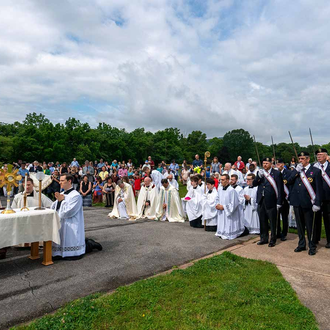 SETON ROUTE | Fourth Degree Knights stand at attention as Supreme Chaplain Archbishop William Lori of Baltimore prays before the Eucharist outside Mother Seton School in Emmitsburg, Md., June 6. Archbishop Lori led a procession in the vicinity of the National Shrine of St. Elizabeth Ann Seton. (Photo by Matthew Barrick).