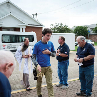 JUAN DIEGO ROUTE | Knights from Jennings (La.) Council 2012 reverently welcome the Blessed Sacrament as the perpetual pilgrims of the Juan Diego Route and their chaplain arrive at Our Lady Help of Christians Catholic Church in Jennings on June 4. (Photo by Jamie Orillion).