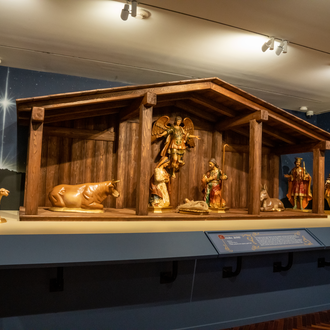 Wood painted Nativity with Holy Family, Angel, 3 Magi, 2 shepherds, a lamb, an ox, and a donkey with a stable.