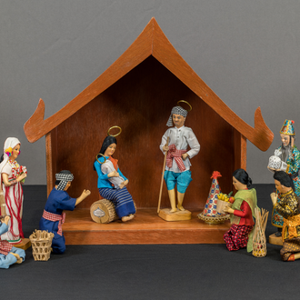 Thai crèche with a stable, the Holy Family & 8 people in traditional Thai clothing. The 8 people are merchants, farmers, nobility, & the Karen people.