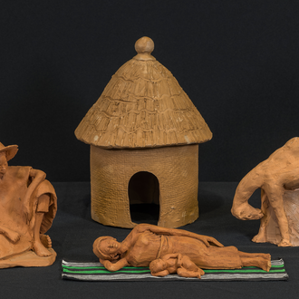 Crèche from Ghana by Mohammed Amin with the Holy Family, camel, hut, and woven carpet. Mary reclines with the Christ Child beside her.