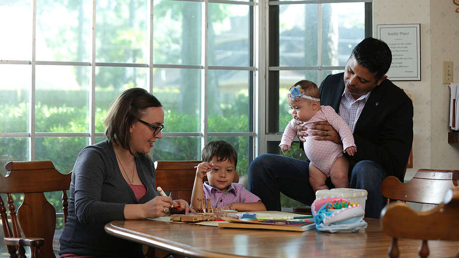 James Cueva and his wife Whitney, spend time with their two young children in their Houston home