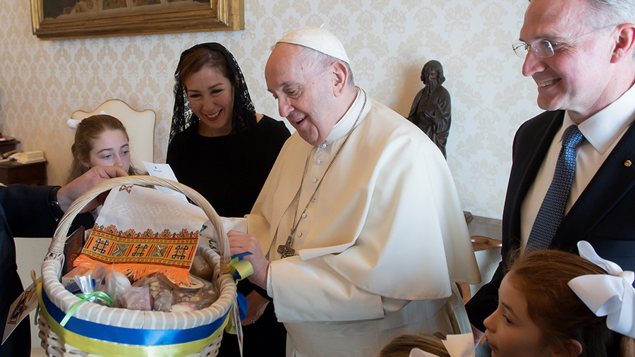 Pope Francis receives an Easter basket presented to him by Supreme Knight Patrick Kelly and his family at the Vatican on April 11. The basket, which the pope blessed, was representative of the thousands of Easter care packages prepared by Polish Knights.