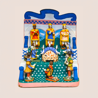 Photo of a clay Nativity with the Holy Family, Magi, and shepherds set on a three tiered throne.