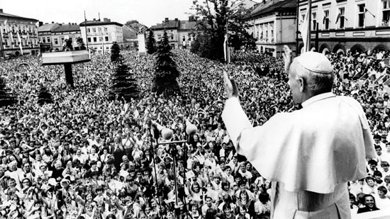 Pope John Paul II waves to a huge crowd of faithful in Wadowice