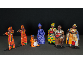 Nativity scene from Senegal featuring Mary holding the Christ Child, Joseph, two shepherds, and the Magi made of wire and dressed with batik fabrics.