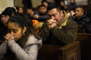 People pray at St. Patrick's Cathedral in New York City.