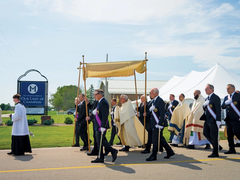 Bishop David Ricken of Green Bay, Wis., carries the Blessed Sacrament at the start of a 1.7-mile Eucharistic procession around the National Shrine of Our Lady of Champion in Champion, Wis., June 16, as part of the Marian Route of the National Eucharistic Pilgrimage. (OSV News photo/Sam Lucero)