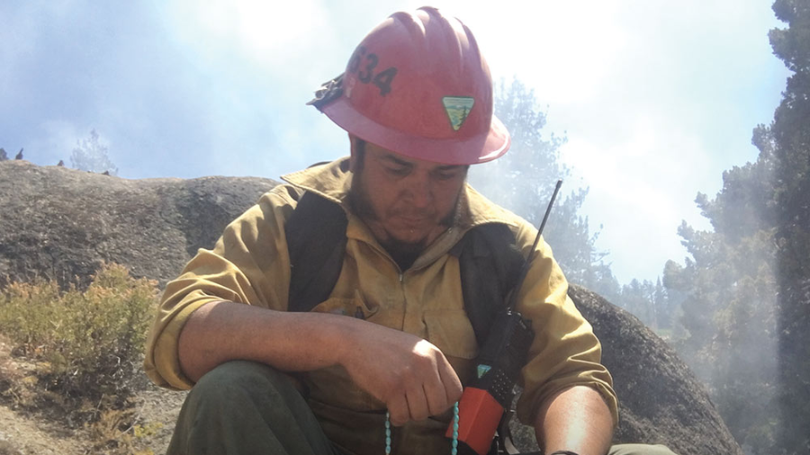 Daniel Magallanes prays the rosary during a break while fighting the Donnell Fire in northern California’s Stanislaus National Forest