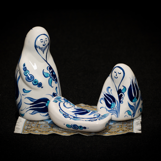 Fritware Holy Family from Turkey handpainted with blue tulips and exhibited on a small turkish rug. 