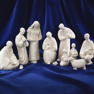 White cement Nativity scene featuring figurines of Holy Family, 3 Magi, a shepherd, two children, and a sheep.
