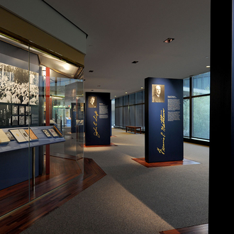 Photo of the Wall of History exhibit looking toward the pylons of Supreme Knights Martin Carmody, Francis Matthews, and John Swift 